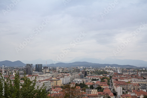 Panoramic view of Downtown Ljubljana, Slovenia taken from above during a cloudy grey sky afternoon seen from above with residential towers. Ljubljana is the biggest city and the capital of Slovenia...