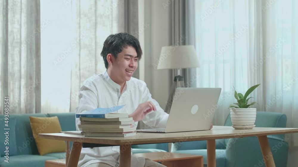 Asian Man Student Having Video Call While Using Computer To Study Online At Home
Asian Man Student Having Video Call While Using Computer To Study Online At Home