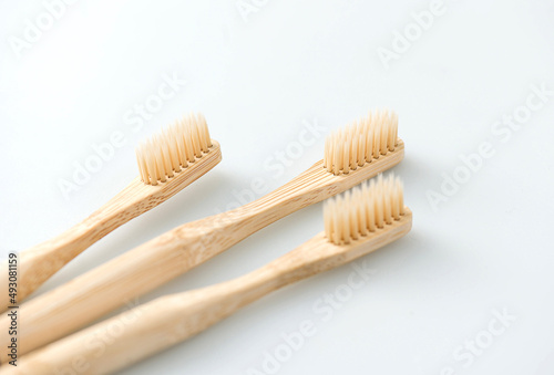 wooden toothbrushes on white background