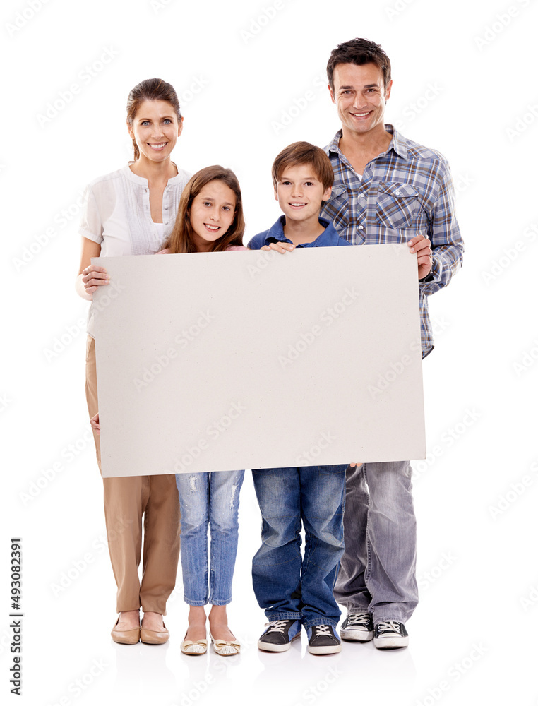 Like. Studio shot of a happy family standing with a blank placard for copyspace. Like. Studio shot of a happy family standing with a blank placard for copyspace.