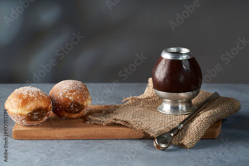 Mate with two Berliners stuffed with dulce de leche.