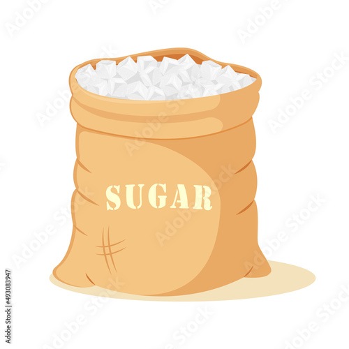 Refined sugar cubes in an open canvas bag. Packing of sweet crystals.