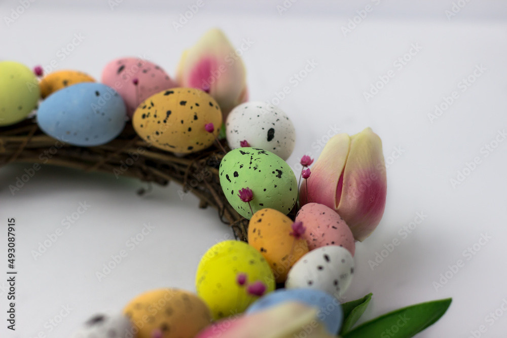 Easter wreath of decorative quail eggs and tulips. Top view of the rattan wreath. Easter decor