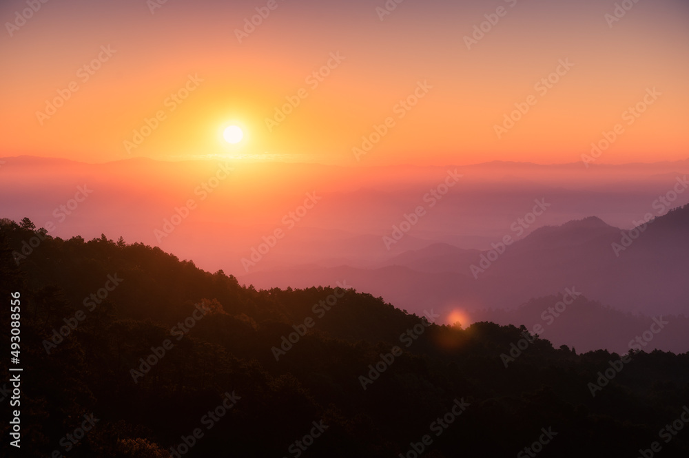 Sunrise over mountain with colorful sky in tropical rainforest at national park in the morning Sunrise over mountain with colorful sky in tropical rainforest at national park in the morning