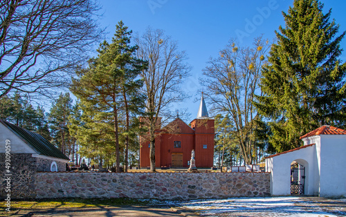 General view and close-up architectural details of the wooden Catholic church of Saint Matthew the Apostle built in 1849 in Jaminy in Podlasie, Poland. photo