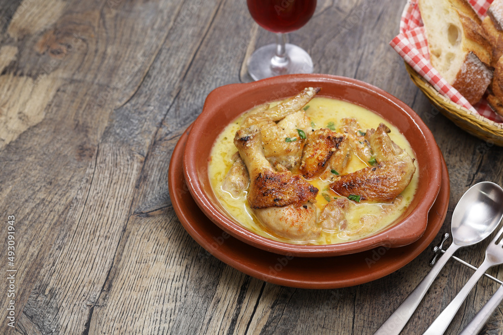 Shkmeruli is a traditional Georgian dish of chicken in garlic milk sauce. Shkmeruli is a traditional Georgian dish of chicken in garlic milk sauce.