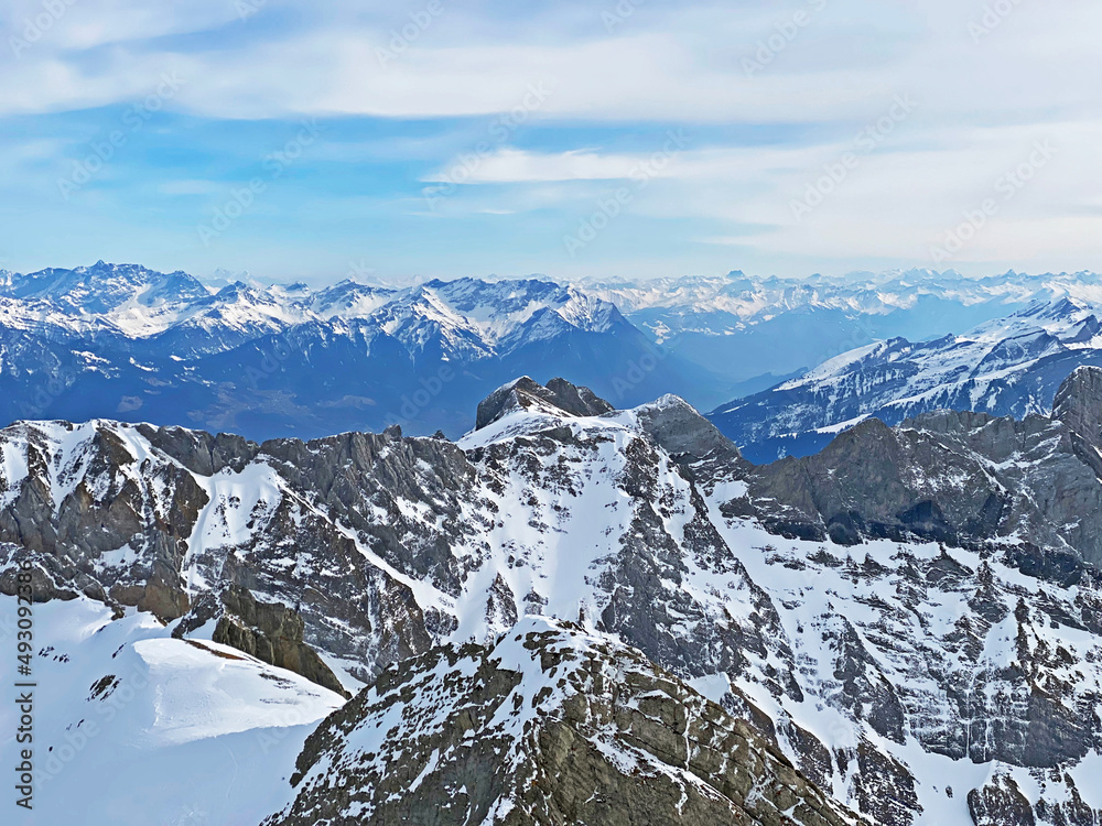 View of the snowy alpine peaks from Säntis, the highest peak of the Alpstein mountain range in the Swiss Alps - Canton of Appenzell Innerrhoden, Switzerland (Schweiz) View of the snowy alpine peaks from Säntis, the highest peak of the Alpstein mountain range in the Swiss Alps - Canton of Appenzell Innerrhoden, Switzerland (Schweiz)