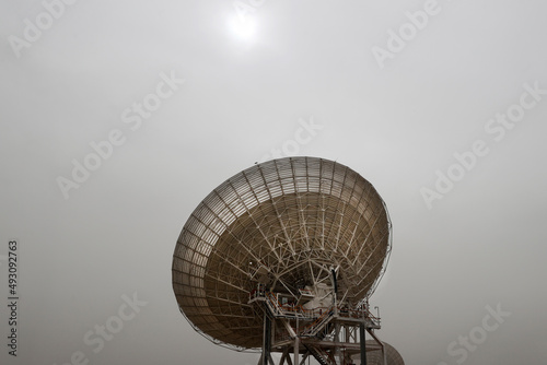 satellite dish radar antenna station in field. parabolic antennas. Big parabolic antenna against sky. Satellite dish at earth station with a sky.
