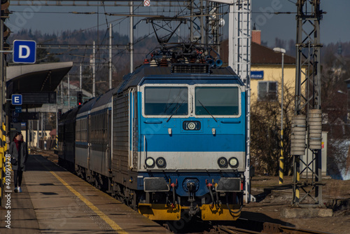 Zabreh station with passenger and cargo trains in sunny day