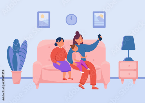 Mother taking selfie on mobile phone with daughters. Woman and girls sitting on couch together at home flat vector illustration. Family, technology concept for banner, website design or landing page