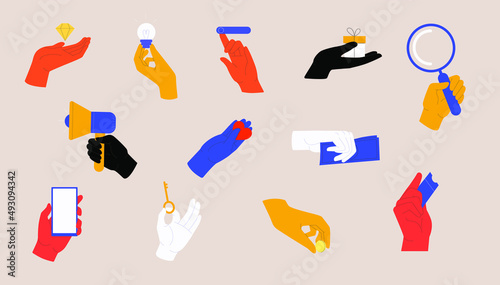 Set of colorful hands holding different objects