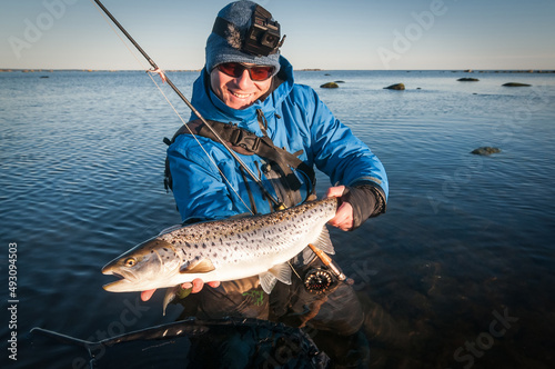Happy angler with nice size seatrout photo