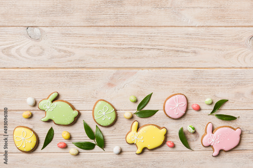 holiday preparation Multi colors Easter eggs with cookies on colored background . Pastel color Easter eggs. holiday concept with copy space holiday preparation Multi colors Easter eggs with cookies on colored background . Pastel color Easter eggs. holiday concept with copy space