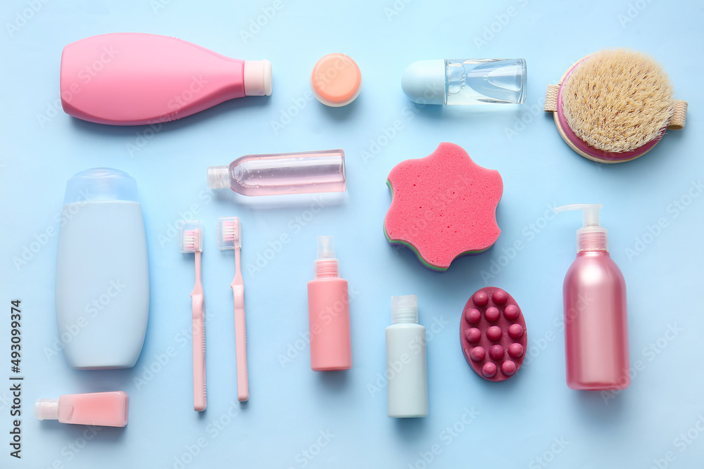 Composition with different cosmetic products and bath supplies on color background