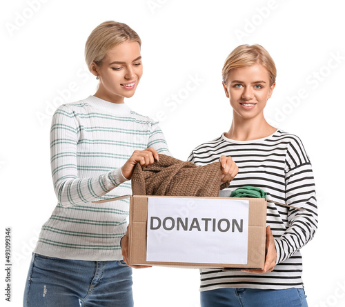 Young women holding box wit...