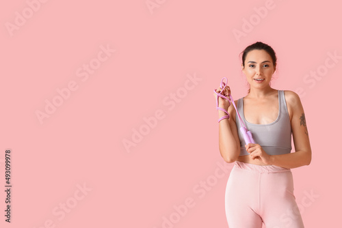 Sporty young woman with ski...