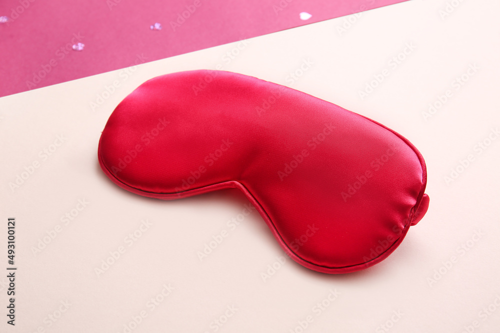 Sleep mask on pink background Sleep mask on pink background