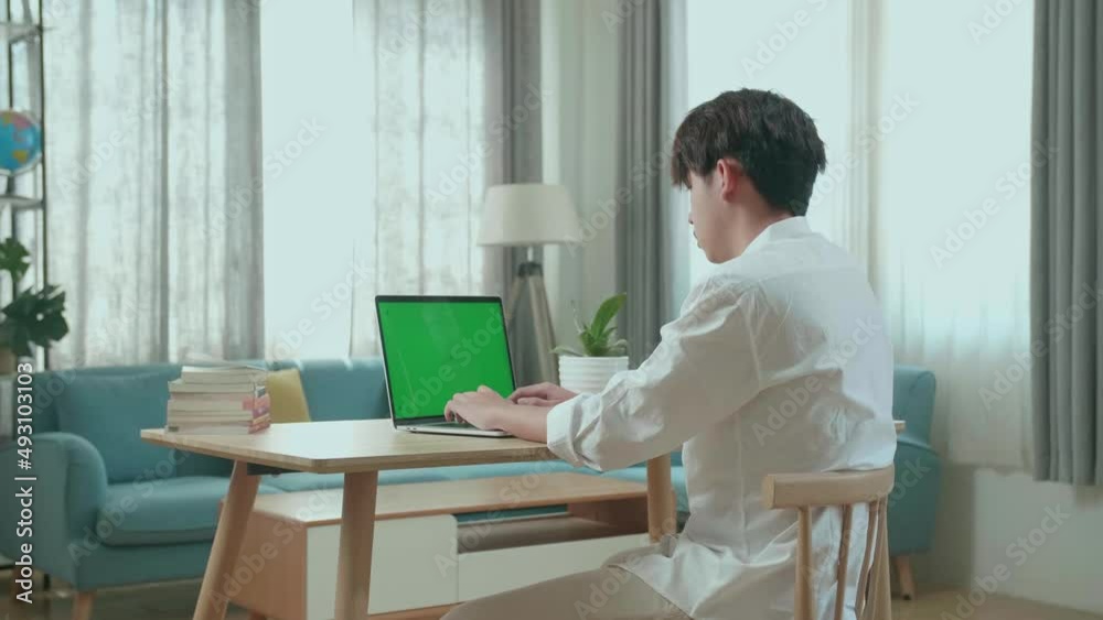 Side View Of Asian Man Student Typing On Green Screen Computer At Home
Side View Of Asian Man Student Typing On Green Screen Computer At Home
