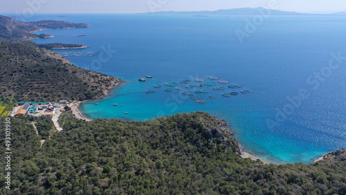Aerial drone photo of small fish farming unit in calm sea of Salamina island, Saronic Gulf, Greece