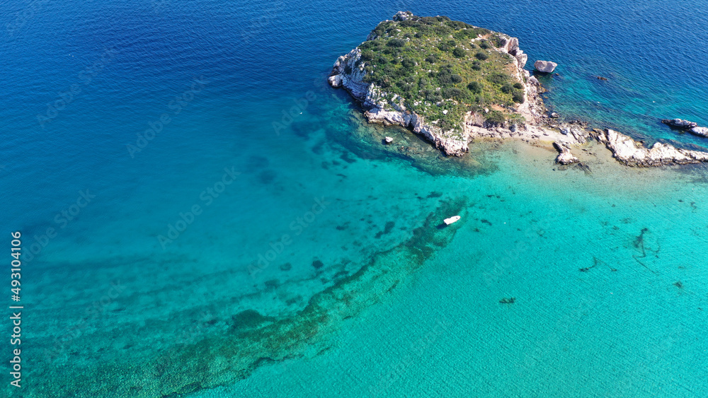 Aerial drone photo of small seaside village and small islets of Peristera with crystal clear turquoise sea ideal for quiet vacation close to Athens, Salamina island, Saronic Gulf, Greece