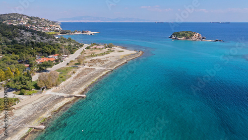 Aerial drone photo of small seaside village and small islets of Peristera with crystal clear turquoise sea ideal for quiet vacation close to Athens, Salamina island, Saronic Gulf, Greece © aerial-drone