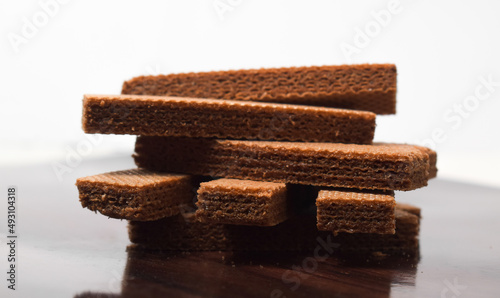 Pile of delicious chocolate wafers, on white background. photo