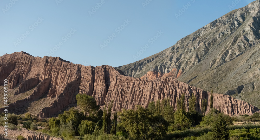 The exquisite multicolor mountains and rock formations surrounding the charming twon of Purmamarca, Jujuy province, Northern Argentina
