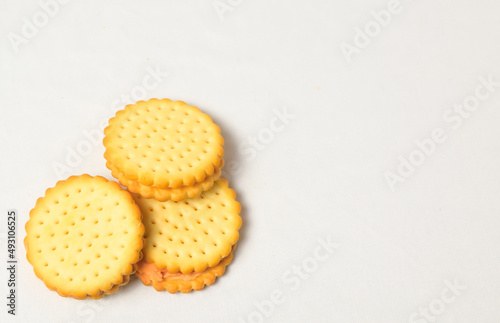 Cheese-flavored biscuits, photo from the top corner, isolated on a white background