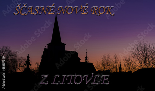 Church in LItovel town with sunrise colors on sky and sigh New year photo