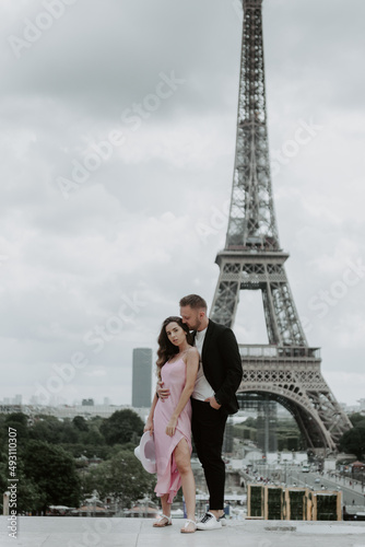 Young romantic couple spending their vacation in Paris, France. Dating couple posing near the Eiffel tower © ALEXSTUDIO