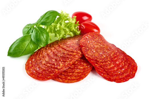 Chorizo sausage, thin cut. Spanish salami, close-up, isolated on white background.