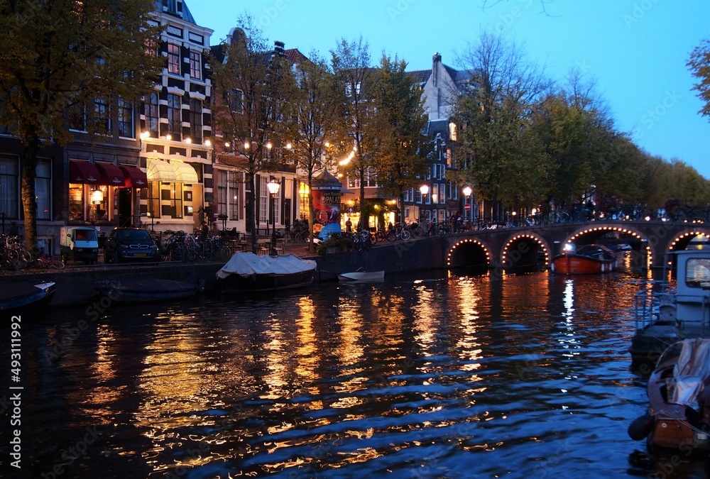 A dusk scenery of Amsterdam with a canal and canal houses