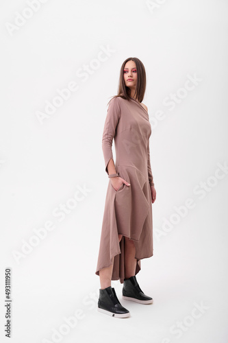 Fashion shooting in studio . Professional model , fashionable clothes and style, new collection. stylish look
