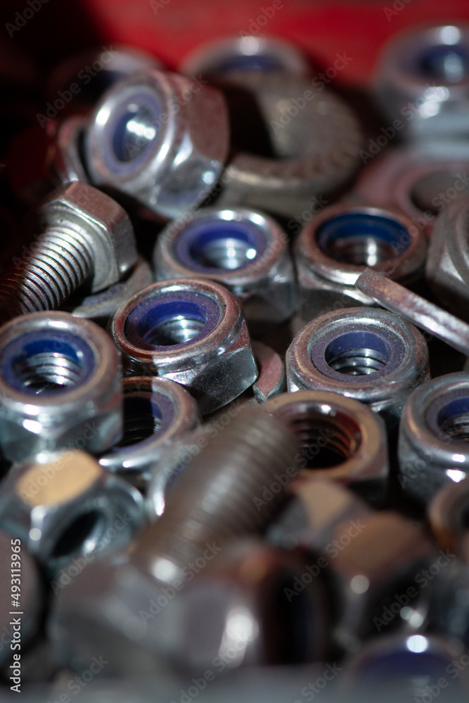 A selection of steel nuts and bolts for industry A selection of steel nuts and bolts for industry