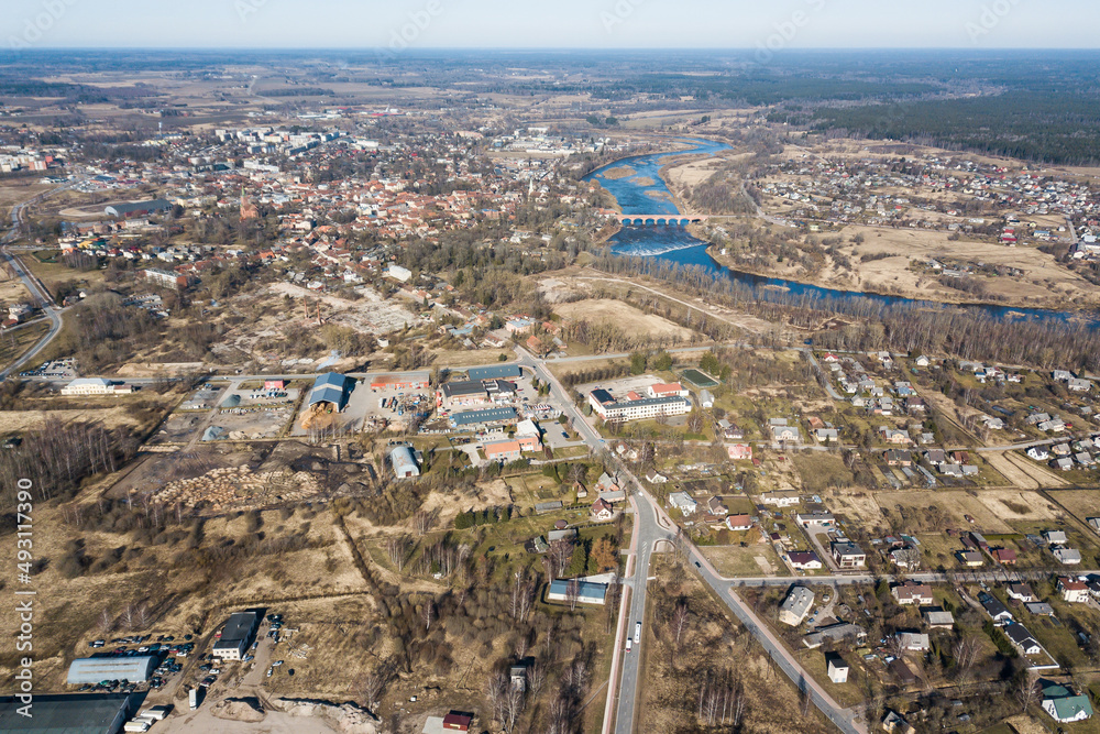 Fototapeta premium Aerial view of Putnudarzs in sunny spring day, Kuldiga, Latvia.