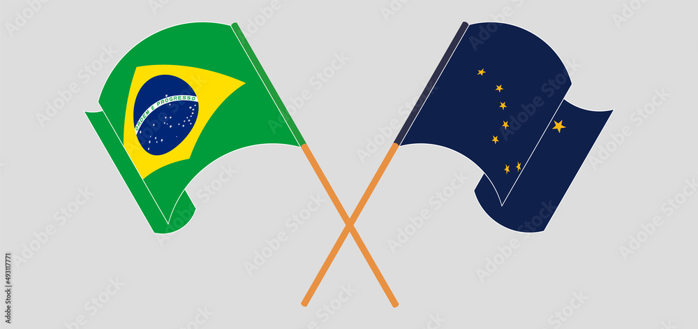 Crossed and waving flags of Brazil and the State of Alaska Crossed and waving flags of Brazil and the State of Alaska