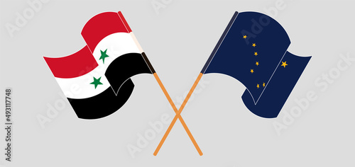 Crossed and waving flags of Syria and the State of Alaska