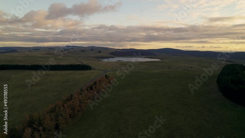 Lonely Lake in French Lowland Under Cloudy Sky at Sunset by Drone