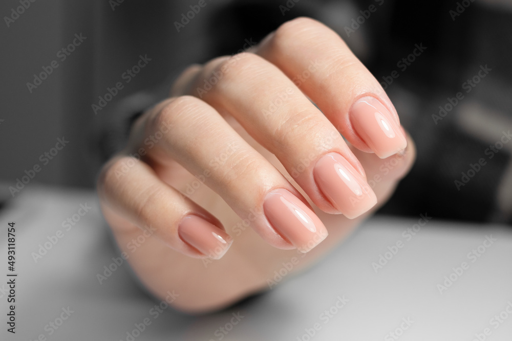 Nude manicure. Beige gel nail polish. Square shaped nails. Stock Photo |  Adobe Stock