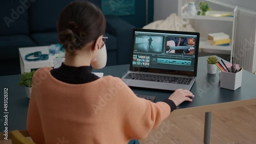 Female colorist working on video footage design with multimedia software, using movie content for remote production project. Woman learning to edit film montage on online course.