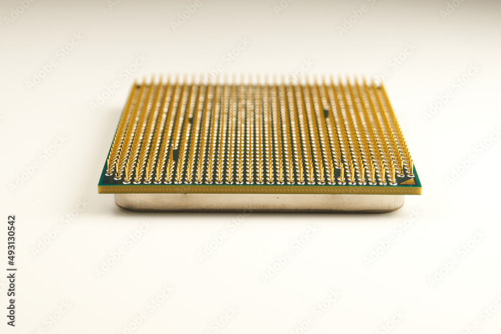 CPU. An old processor of 2009 release Athlon II X2 240 on a white background. Focus in the foreground. Virtual Museum of Electronics. CPU. An old processor of 2009 release Athlon II X2 240 on a white background. Focus in the foreground. Virtual Museum of Electronics.
