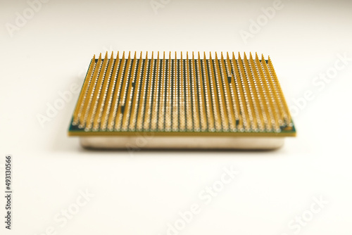 CPU. An old processor of 2009 release Athlon II X2 240 on a white background. Focus in the background. Virtual Museum of Electronics. photo