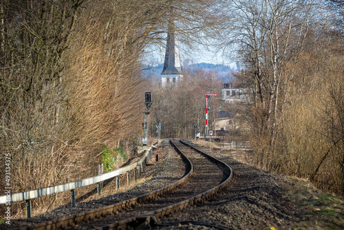 Bahngleise vor Kirchturm photo