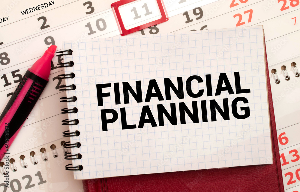 On a light blue background, reports, a magnifying glass, a pen and a notebook with the text FINANCIAL PLANNING.