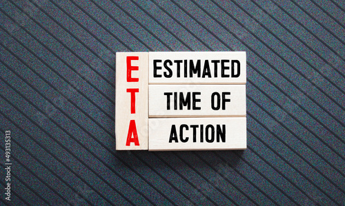 text estimated time of action on wooden block photo