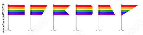Realistic various table flags on a chrome steel pole. Rainbow LGBT desk flag made of paper or fabric. Shiny metal stand. Mockup for promotion and advertising. Vector illustration