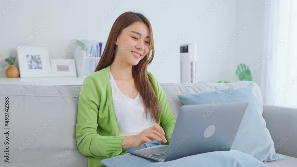 Asian young business woman typing on computer and working from home. Asian young business woman typing on computer and working from home.
