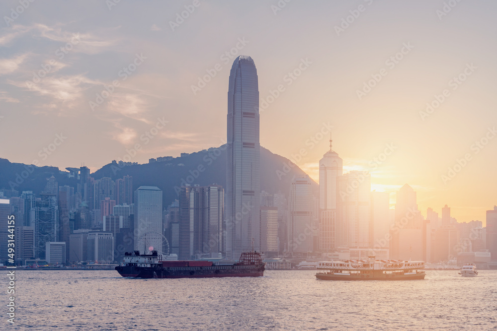 View of Hong Kong harbour at sunset time.
