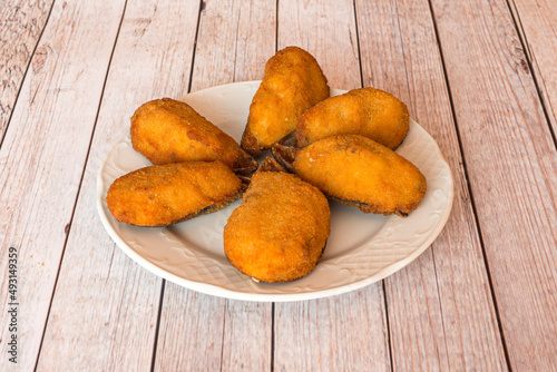 Tigres are a dish originating in Cullera, but they are offered in practically all of Spain and consist of stuffed, battered and fried mussel shells. photo