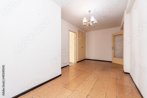 Wallpaper Mural Empty room with cork tile flooring and cream painted wooden doors Torontodigital.ca